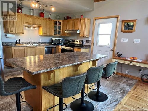 12 Sunset Lane, Currie, NB - Indoor Photo Showing Kitchen With Double Sink