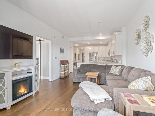 311-135 Orr St, Cobourg, ON - Indoor Photo Showing Living Room With Fireplace