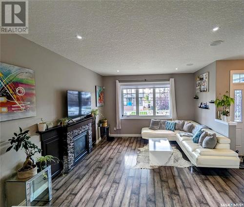 8718 Hincks Lane, Regina, SK - Indoor Photo Showing Living Room With Fireplace