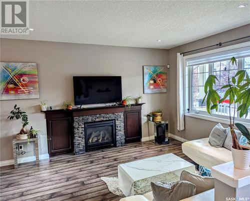 8718 Hincks Lane, Regina, SK - Indoor Photo Showing Living Room With Fireplace