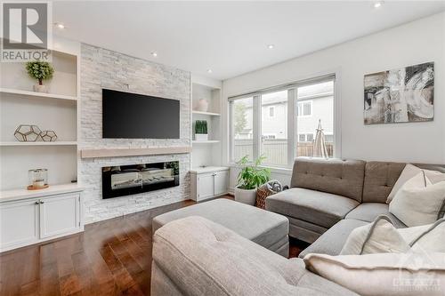 440 White Arctic Avenue, Ottawa, ON - Indoor Photo Showing Living Room With Fireplace