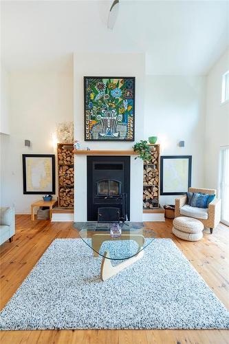 22 Thorvaldson Drive, Arnes, MB - Indoor Photo Showing Living Room With Fireplace