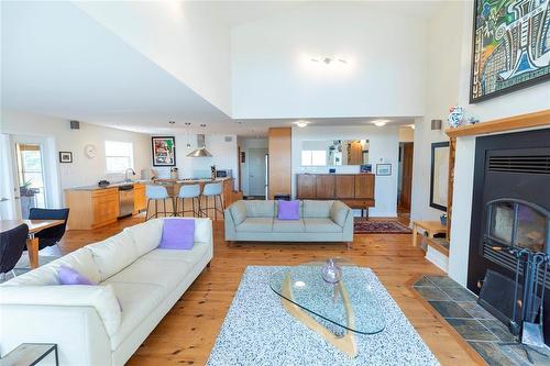 22 Thorvaldson Drive, Arnes, MB - Indoor Photo Showing Living Room With Fireplace