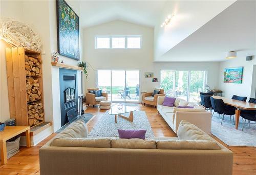 22 Thorvaldson Drive, Arnes, MB - Indoor Photo Showing Living Room With Fireplace