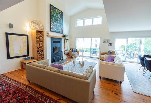 22 Thorvaldson Drive, Arnes, MB - Indoor Photo Showing Living Room With Fireplace