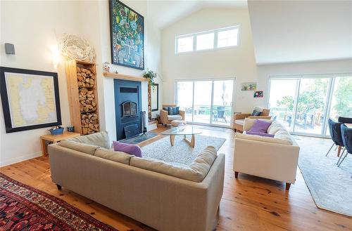 22 Thorvaldson Drive, Arnes, MB - Indoor Photo Showing Living Room With Fireplace