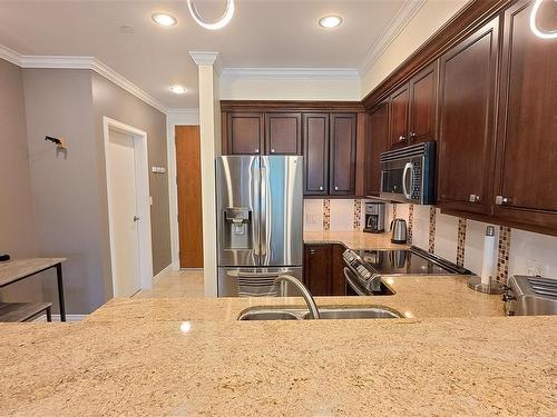 213-1325 Bear Mountain Pkwy, Langford, BC - Indoor Photo Showing Kitchen With Double Sink