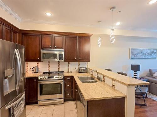 213-1325 Bear Mountain Pkwy, Langford, BC - Indoor Photo Showing Kitchen With Double Sink