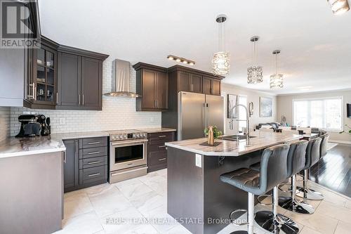 27 Marilyn Avenue S, Wasaga Beach, ON - Indoor Photo Showing Kitchen With Upgraded Kitchen