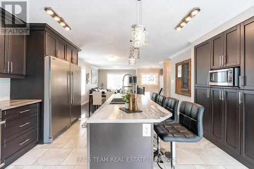 27 Marilyn Avenue S, Wasaga Beach, ON - Indoor Photo Showing Kitchen With Upgraded Kitchen