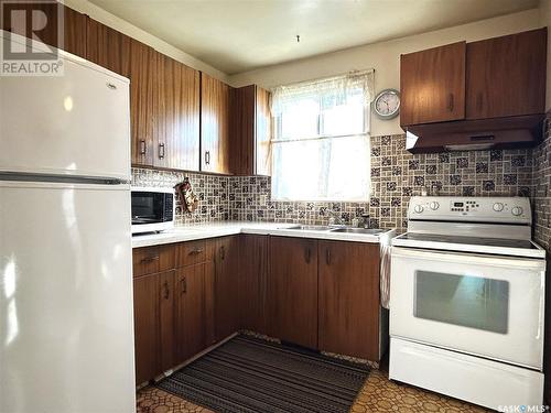 53 Mcgee Crescent, Saskatoon, SK - Indoor Photo Showing Kitchen With Double Sink