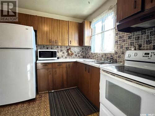 53 Mcgee Crescent, Saskatoon, SK - Indoor Photo Showing Kitchen With Double Sink