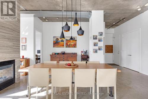 Ph1103 - 23 Brant Street, Toronto, ON - Indoor Photo Showing Dining Room With Fireplace