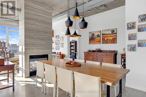 Ph1103 - 23 Brant Street, Toronto, ON - Indoor Photo Showing Dining Room With Fireplace