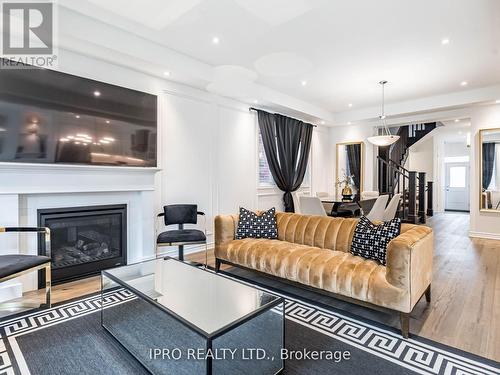 1406 Lobelia Crescent, Milton, ON - Indoor Photo Showing Living Room With Fireplace