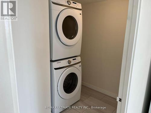 1410 - 3233 Eglinton Avenue E, Toronto, ON - Indoor Photo Showing Laundry Room