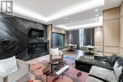 725 - 9 Mabelle Avenue, Toronto, ON - Indoor Photo Showing Living Room With Fireplace