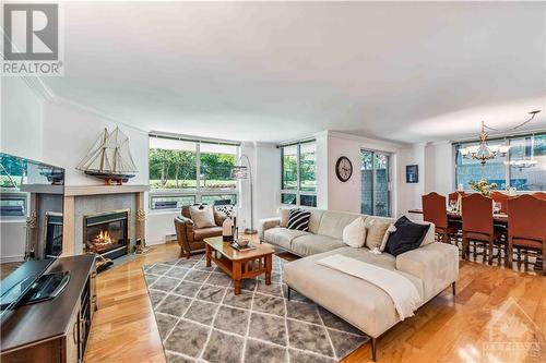 3105 Carling Avenue Unit#B-1, Ottawa, ON - Indoor Photo Showing Living Room With Fireplace