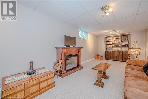 Rec Room with cozy electric fire place (included) - 310 Lanark Street, Caledonia, ON - Indoor Photo Showing Living Room With Fireplace