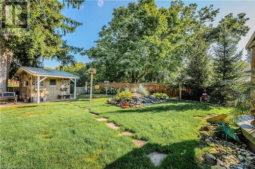 Beautifully landscaped with serene waterfall - 310 Lanark Street, Caledonia, ON - Outdoor With Deck Patio Veranda