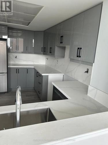 807 - 8 Lisa Street, Brampton (Queen Street Corridor), ON - Indoor Photo Showing Kitchen With Double Sink