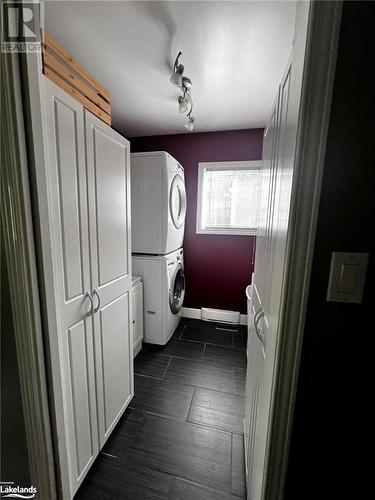 Main Floor Laundry with sink and storage - 1571 Buckslide Road, Algonquin Highlands, ON - Indoor Photo Showing Laundry Room