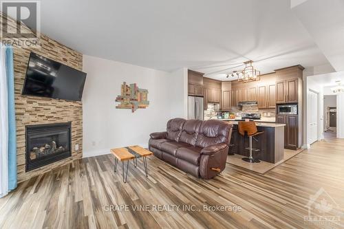 2 - 181 Bourdeau Boulevard, Prescott And Russell, ON - Indoor Photo Showing Living Room With Fireplace