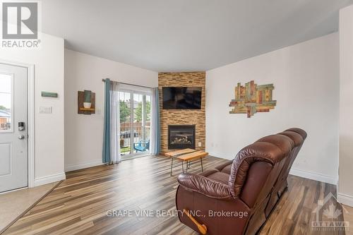 2 - 181 Bourdeau Boulevard, Prescott And Russell, ON - Indoor Photo Showing Living Room With Fireplace