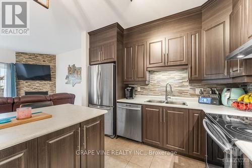 2 - 181 Bourdeau Boulevard, Prescott And Russell, ON - Indoor Photo Showing Kitchen With Double Sink