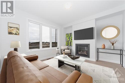 Virtual stage - 161 Invention Boulevard, Ottawa, ON - Indoor Photo Showing Living Room With Fireplace