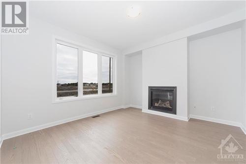 161 Invention Boulevard, Ottawa, ON - Indoor Photo Showing Living Room With Fireplace