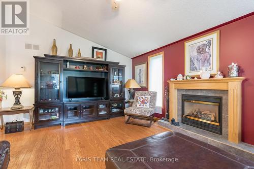 2 St James Place, Wasaga Beach, ON - Indoor Photo Showing Living Room With Fireplace