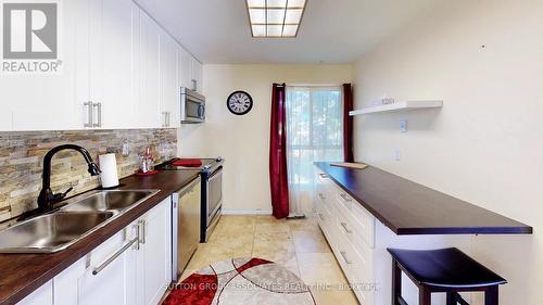 81 - 615 Rathburn Road E, Toronto, ON - Indoor Photo Showing Kitchen With Double Sink