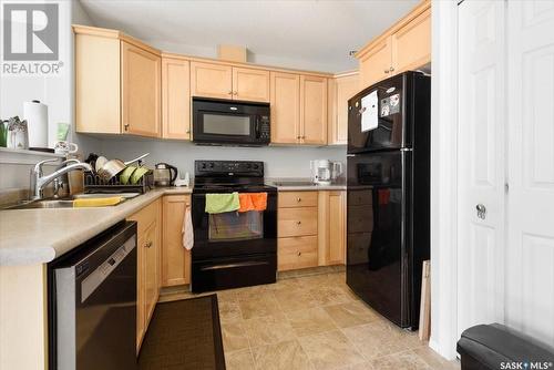 12 4425 Nicurity Drive, Regina, SK - Indoor Photo Showing Kitchen With Double Sink