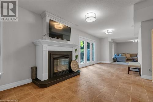 Lower level rec room - 275 4Th Street Crescent, Hanover, ON - Indoor Photo Showing Living Room With Fireplace