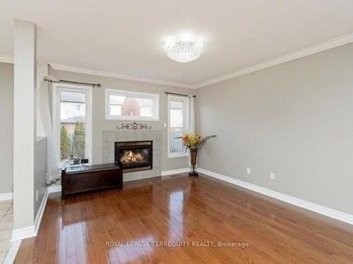 7087 Drumcashel Crt, Mississauga, ON - Indoor Photo Showing Living Room With Fireplace