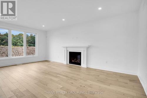 3958 Campbell Street N, London, ON - Indoor Photo Showing Living Room With Fireplace