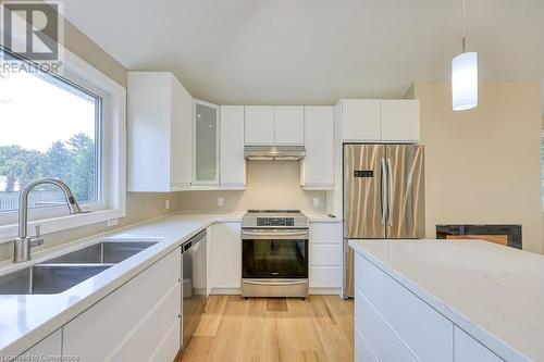 Stainless appliances, bright open work space. - 6765 James Street, London, ON - Indoor Photo Showing Kitchen With Double Sink