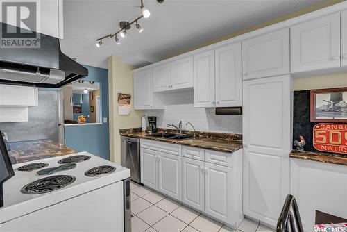 306 301 Cree Crescent, Saskatoon, SK - Indoor Photo Showing Kitchen With Double Sink