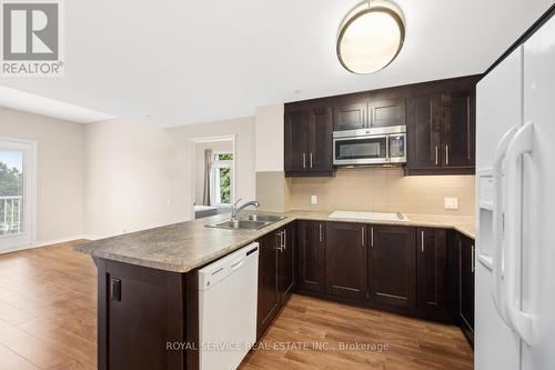 311 - 239 James Street E, Cobourg, ON - Indoor Photo Showing Kitchen With Double Sink