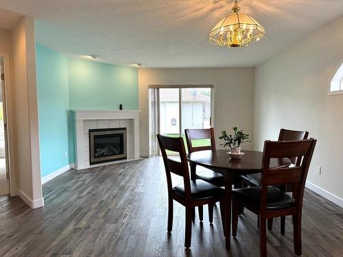 20-1901 Maxwell Ave, Merritt, BC - Indoor Photo Showing Dining Room With Fireplace