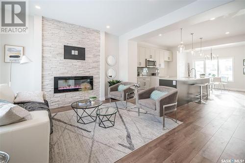 5504 Nicholson Avenue E, Regina, SK - Indoor Photo Showing Living Room With Fireplace