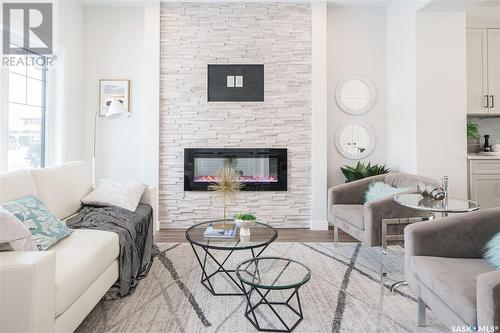 5504 Nicholson Avenue E, Regina, SK - Indoor Photo Showing Living Room With Fireplace