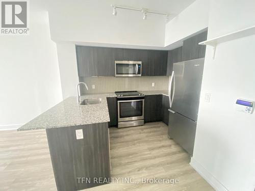 2305 - 20 Shore Breeze Drive, Toronto, ON - Indoor Photo Showing Kitchen With Upgraded Kitchen