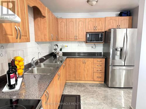 188 - 6448 Finch Avenue W, Toronto, ON - Indoor Photo Showing Kitchen With Stainless Steel Kitchen With Double Sink