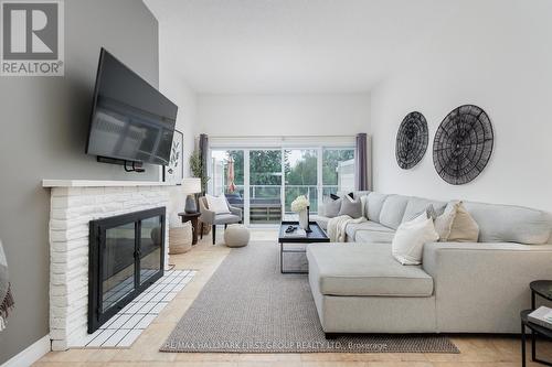 9 - 4 Paradise Boulevard, Ramara, ON - Indoor Photo Showing Living Room With Fireplace