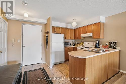 303 - 107 Bond Street, Orillia, ON - Indoor Photo Showing Kitchen With Double Sink