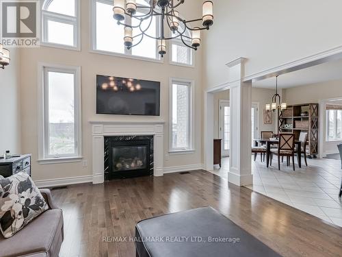 25 Keenan Drive, Adjala-Tosorontio, ON - Indoor Photo Showing Living Room With Fireplace