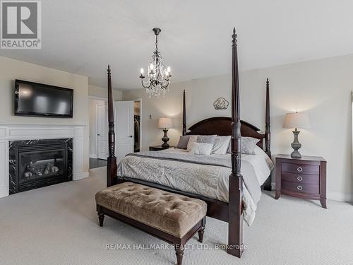 25 Keenan Drive, Adjala-Tosorontio, ON - Indoor Photo Showing Bedroom With Fireplace