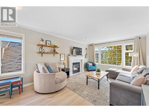 300 Murray Crescent, Kelowna, BC - Indoor Photo Showing Living Room With Fireplace